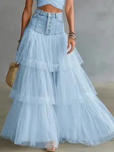 Detail shot of women's high waist denim and tulle spliced tiered maxi skirt, elegant multi layer design.