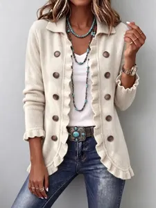 Close-up detail of women's solid knit cardigan featuring elegant ruffles and vintage buttons.