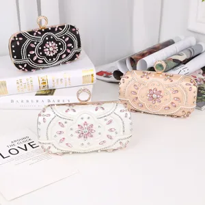 Vintage rhinestone beaded evening clutch bag with ring clasp and floral embroidery details.