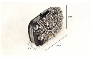 Black rhinestone evening clutch bag with metal frame, elegant crystal bridal purse for women.