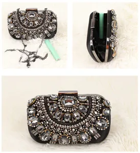 Detailed view of the rhinestone evening clutch, sparkling crystals and metal chain.