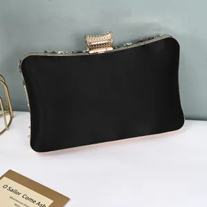 Elegant black evening clutch bag with rhinestone metal clasp, luxury beaded design for women.