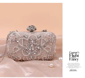 Exquisite rhinestone beaded evening clutch bag detail showing floral design and metal chain.