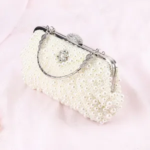 Elegant white pearl evening clutch bag with crystal clasp and metal handle for women.