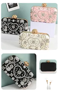 Handcrafted rhinestone evening clutch bag with elegant pearl heart design for women formal events.