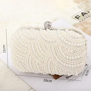 Elegant pearl evening clutch bag with crystal ball clasp for women weddings and formal parties.