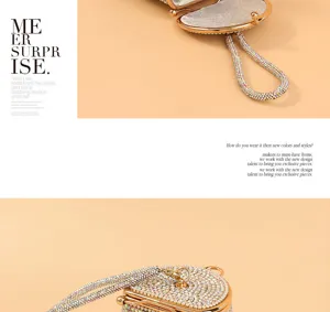 Detailed close-up of luxurious rhinestone evening bag with sparkling crystal handle and lock.