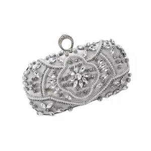 Elegant silver rhinestone evening clutch bag with pearl beading and stylish ring clasp.