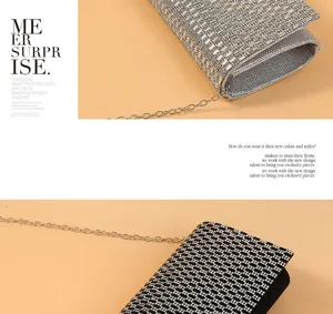 Sparkling rhinestone evening clutch bag detail showing texture and silver chain strap.
