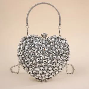 Exquisite crystal rhinestone details on this heart evening bag showcase luxury and elegance.