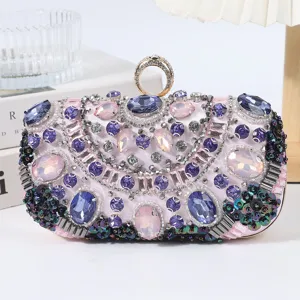 Exquisite embellished evening clutch bag with sparkling purple rhinestones and crystal ring.