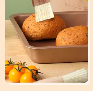 Wooden handle pastry brush detail view for baking, oiling, and barbecue food preparation.