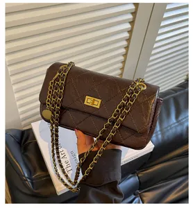 Detail view of the elegant brown quilted chain shoulder bag, classic design for daily commute.