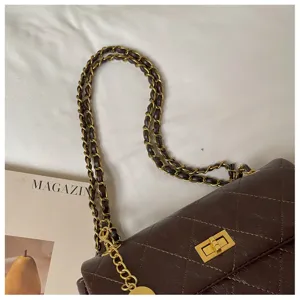 Dark brown quilted leather shoulder bag with gold chain strap, chic daily commuter bag.