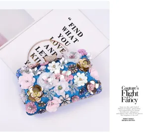 Stunning 3D sequin flower details and sparkling rhinestones on this elegant blue evening clutch.