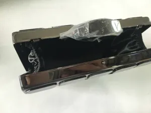 Black acrylic evening clutch bag, metallic frame detailed close up view for women party.