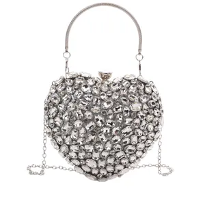 Sparkling rhinestone heart-shaped evening clutch bag with metal handle and chain.