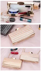 Stylish acrylic evening clutch bag with chain strap for women, elegant striped design for party.