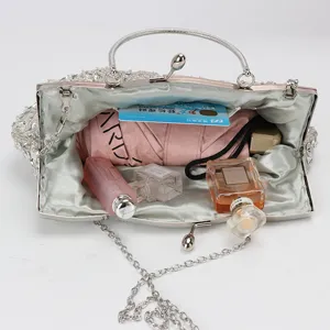 Vintage beaded evening bag with rhinestone and metal frame, elegant clutch for wedding party.
