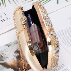 Stunning elegant rhinestone evening clutch bag with beaded chain and metal frame.