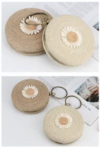 Round straw woven handbag with cute daisy and metal ring, stylish summer beach shoulder bag.