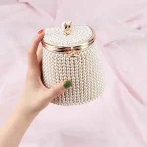 Elegant pearl bucket bag for women, exquisite beaded handbag with gold clasp for evening.