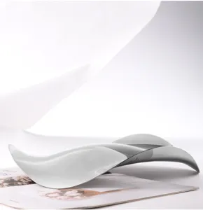 Modern stainless steel wavy fruit plate, creative mirror polished candy dish for home decor.