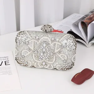 Elegant rhinestone beaded evening clutch bag for women, sparkling floral design party purse.