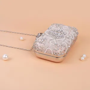 Elegant beaded rhinestone evening clutch bag with chain strap for women party dress accessorizing.