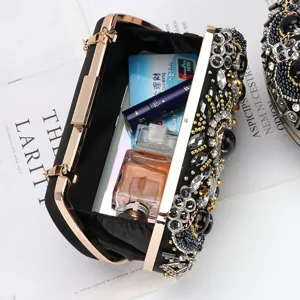 Elegant black beaded evening clutch bag with crystal embellishments for wedding parties and formal dresses.