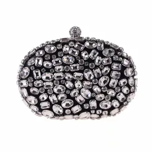 Elegant oval rhinestone evening clutch bag with sparkling crystals for luxury parties.
