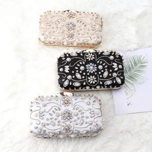 Elegant satin evening clutch bag with handmade rhinestones, crystal beads and metal clasp.