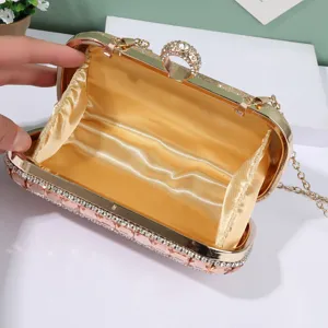 Elegant rhinestone evening clutch bag with ring clasp and chain strap for women parties.
