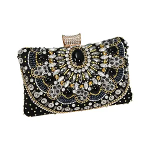 Elegant black evening clutch bag with heavy crystal bead embroidery and rhinestones for women.