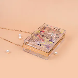 Transparent acrylic graffiti crossbody bag for women, stylish clear box clutch with chain strap.