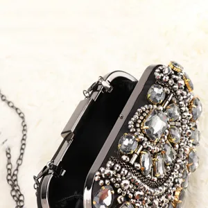 Elegant rhinestone evening clutch bag with chain strap and beaded design for women parties.