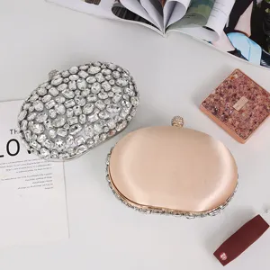 Elegant oval rhinestone evening bag and satin crystal clutch for luxury parties and formal events.