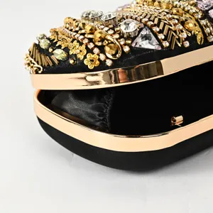 Black beaded rhinestone evening clutch bag with gold metal frame, elegant party handbag.