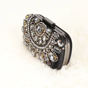 Elegant black rhinestone evening clutch bag with exquisite beading and metal frame for women.