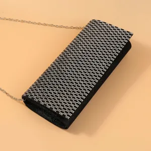 Sparkling rhinestone evening clutch bag with chain strap for party and wedding events.