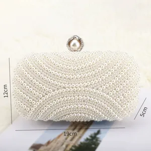 Detailed view of elegant pearl beaded evening clutch bag, perfect for luxury parties and weddings.