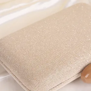 Exquisite champagne glitter evening clutch bag detail view, elegant bridal party handbag.