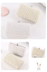 Detailed view of elegant pearl evening clutch bag with rhinestone clasp for formal dress events.