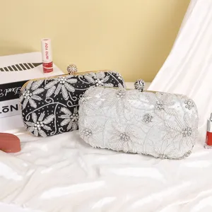 Exquisite beaded evening clutch bag with crystal floral embroidery and metal clasp frame.