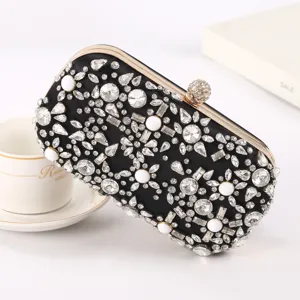 Elegant black rhinestone evening clutch bag with sparkling crystals and pearls for parties.