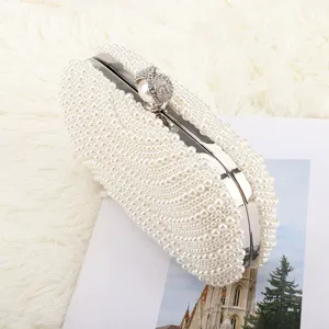 Elegant white pearl evening clutch bag for women, luxury wedding bridal handbag main view.