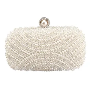 Elegant white pearl evening clutch bag, perfect for wedding, party, and formal dress styling.