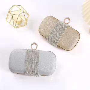 Elegant rhinestone tassel evening clutch bag, sparkling glitter bridal party handbag for women.