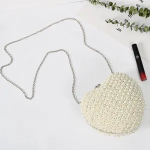 Heart-shaped pearl beaded evening bag, elegant clutch purse with chain strap for party.