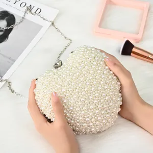 Heart-shaped pearl evening bag, elegant beaded clutch purse for women parties and banquets.